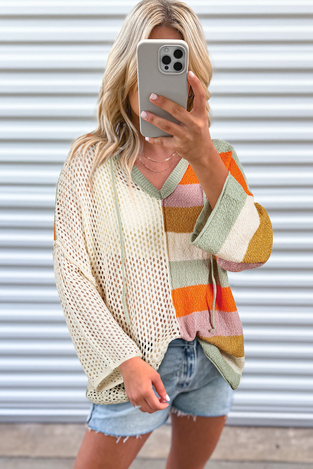 Beige Oversized Colorblock V Neck Hooded SweaterMaterial:100%Acrylic

• Soft and cozy, this sweater offers a relaxed fit perfect for a laid-back day out.
• The rib-knit design adds texture and depth to the sweat