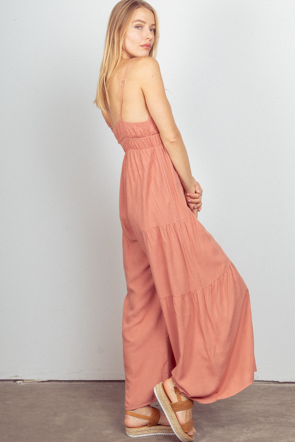 VERY J Sleeveless Ruched Wide Leg JumpsuitThe Woven Wide Leg Jumpsuit is a stylish and versatile outfit option. This sleeveless jumpsuit features adjustable straps for a customizable fit. The elastic waist a