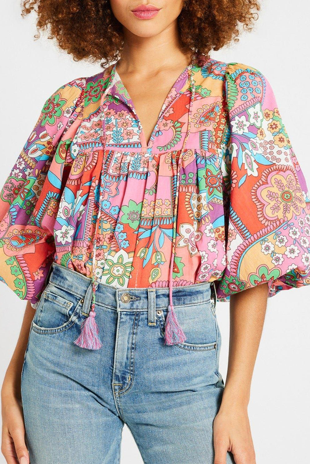 Multicolour Boho Floral Tie V Neck Pleated Blouse• Embrace a vibrant bohemian style with our blouse, featuring a playful fringe detail that adds a touch of whimsy to your ensemble.
• The intricate floral print des