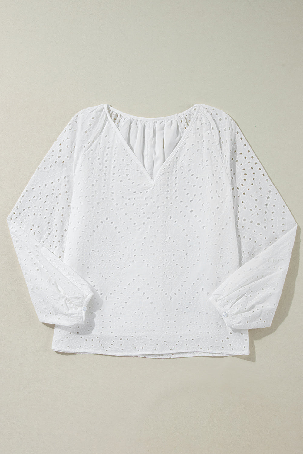 White Eyelet Embroidered V Neck Puff Sleeve BlouseMaterial:100%Cotton

• Delicate white eyelet embroidery adorns this charming blouse, adding a touch of elegance to your outfit. 
• The V-neck design creates a flat