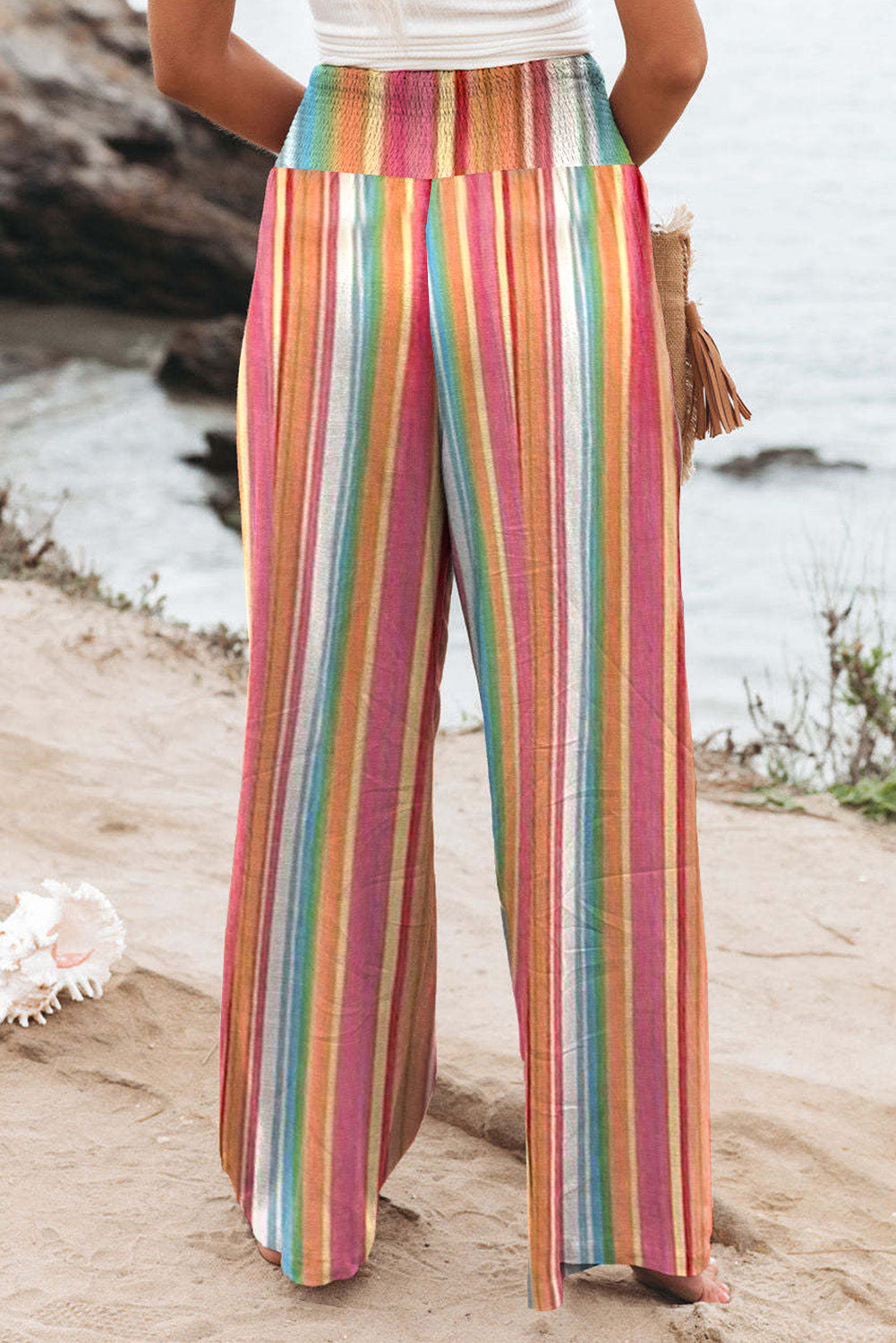 Multicolor Striped Smocked High Waisted Wide Leg Beach PantsMaterial:100%Polyester



		Made of lightweight and breathable fabric perfect for the beach or summer days.
	
	
		Features a smocked high waist design for a fla