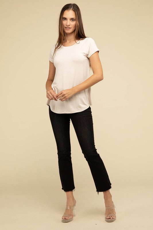 Flowy Round Hem Rayon Short Sleeve TopThe Flowy Round Hem Rayon Short Sleeve Top is the perfect addition to your casual wardrobe. Crafted from soft, lightweight rayon, this top features a relaxed fit and