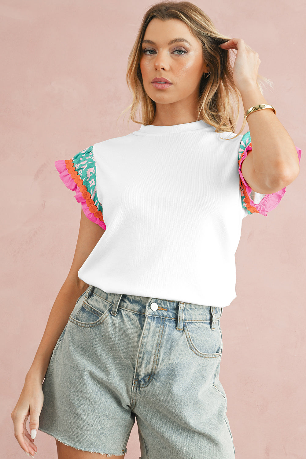 White Color Block Floral Print Ruffle Sleeve BlouseMaterial:70%Polyester+25%Cotton+5%Elastane

• Stand out in style with this blouse, featuring delicate floral appliques and charming ruffle details.
• Embrace a cas