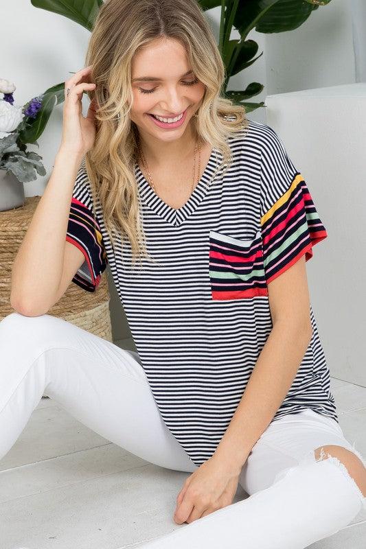 MULTI STRIPE BOXY TOP- Multi stripe boxy top- Pullover short sleeves- V neck chest pocket- Multi stripe jersey - Model is 5' 8" 34-24-34 and wearing a Small- S/M/L 2-2-2- 95% RAYON, 5% S