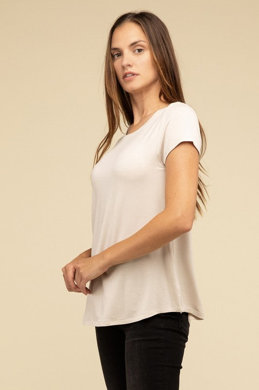 Flowy Round Hem Rayon Short Sleeve TopThe Flowy Round Hem Rayon Short Sleeve Top is the perfect addition to your casual wardrobe. Crafted from soft, lightweight rayon, this top features a relaxed fit and