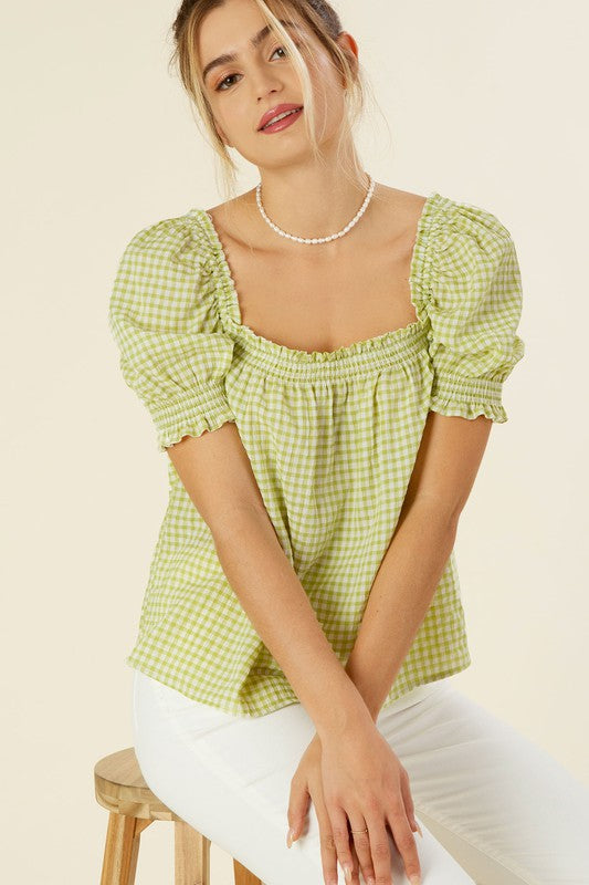 Smocked blouse with puff sleeve- Smocked blouse with puff sleeve- Pattern type : gingham check (yarn dyed)- Neck line : square neck- Sleeve type : puff sleeves- Sleeve length : short sleeves- Stre