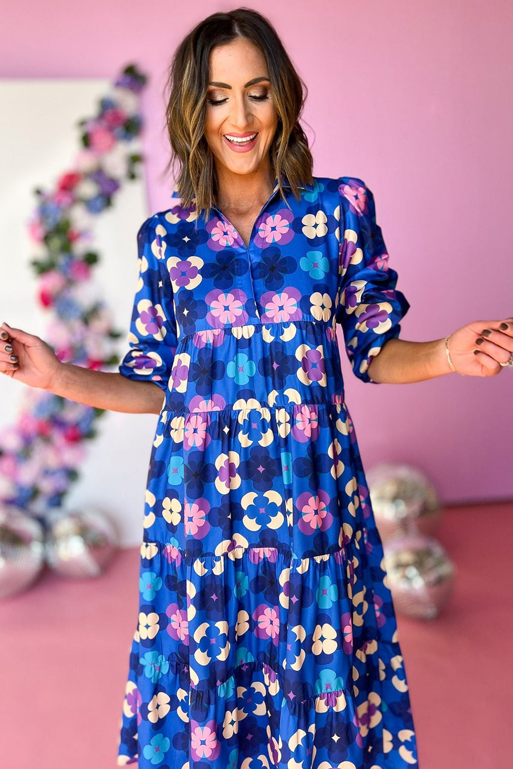 Blue Floral Peasant Sleeve Tiered Ruffle Midi DressMaterial:100%Polyester

• Embrace the charm of bohemian style with this midi dress, featuring a beautiful blue floral print that exudes effortless elegance.
• The 