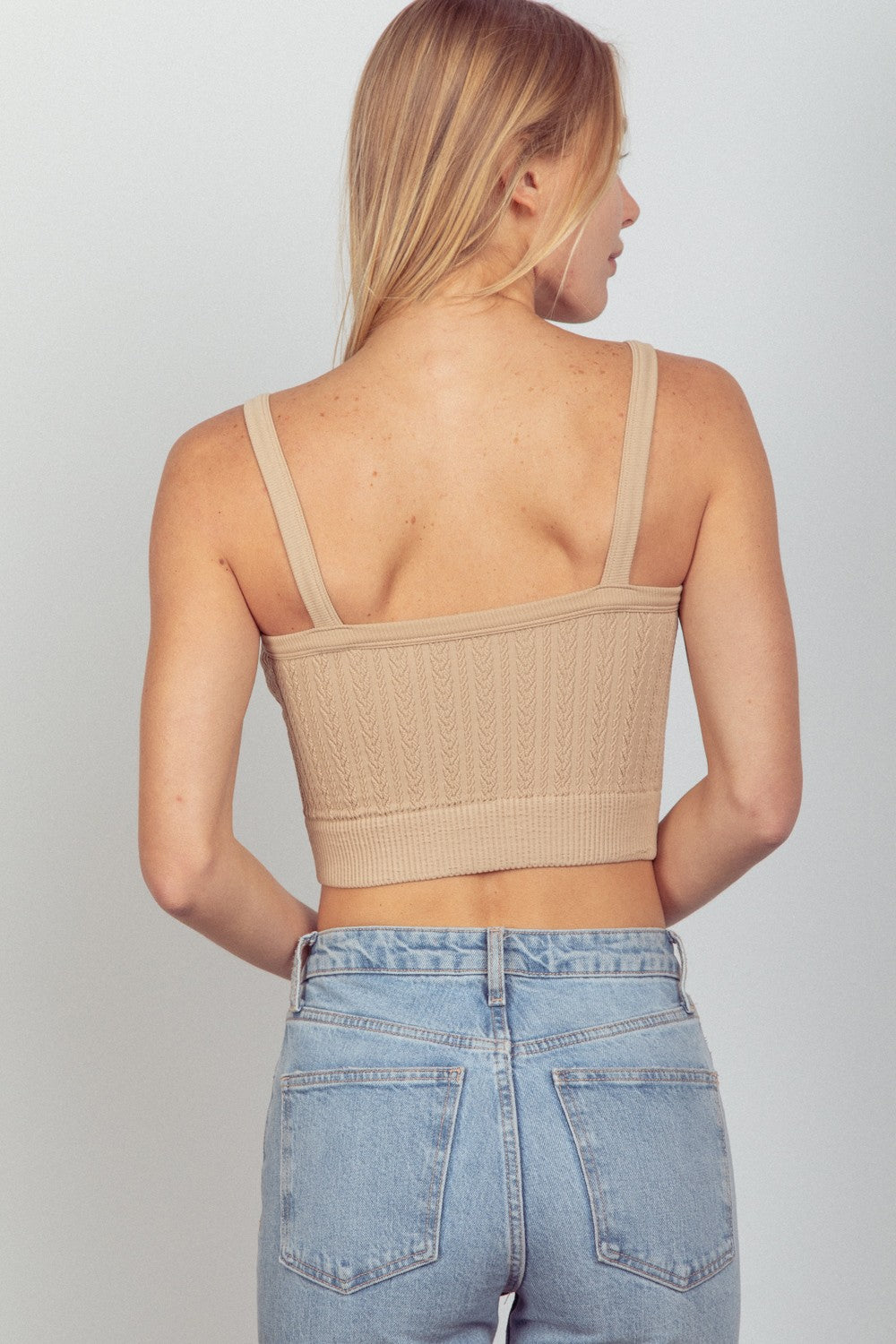 VERY J Cable Knit Seamless Cropped CamiThe Cable Knit Seamless Cropped Cami combines comfort with style for a chic and cozy look. This cami features a cable knit design that adds texture and detail to any