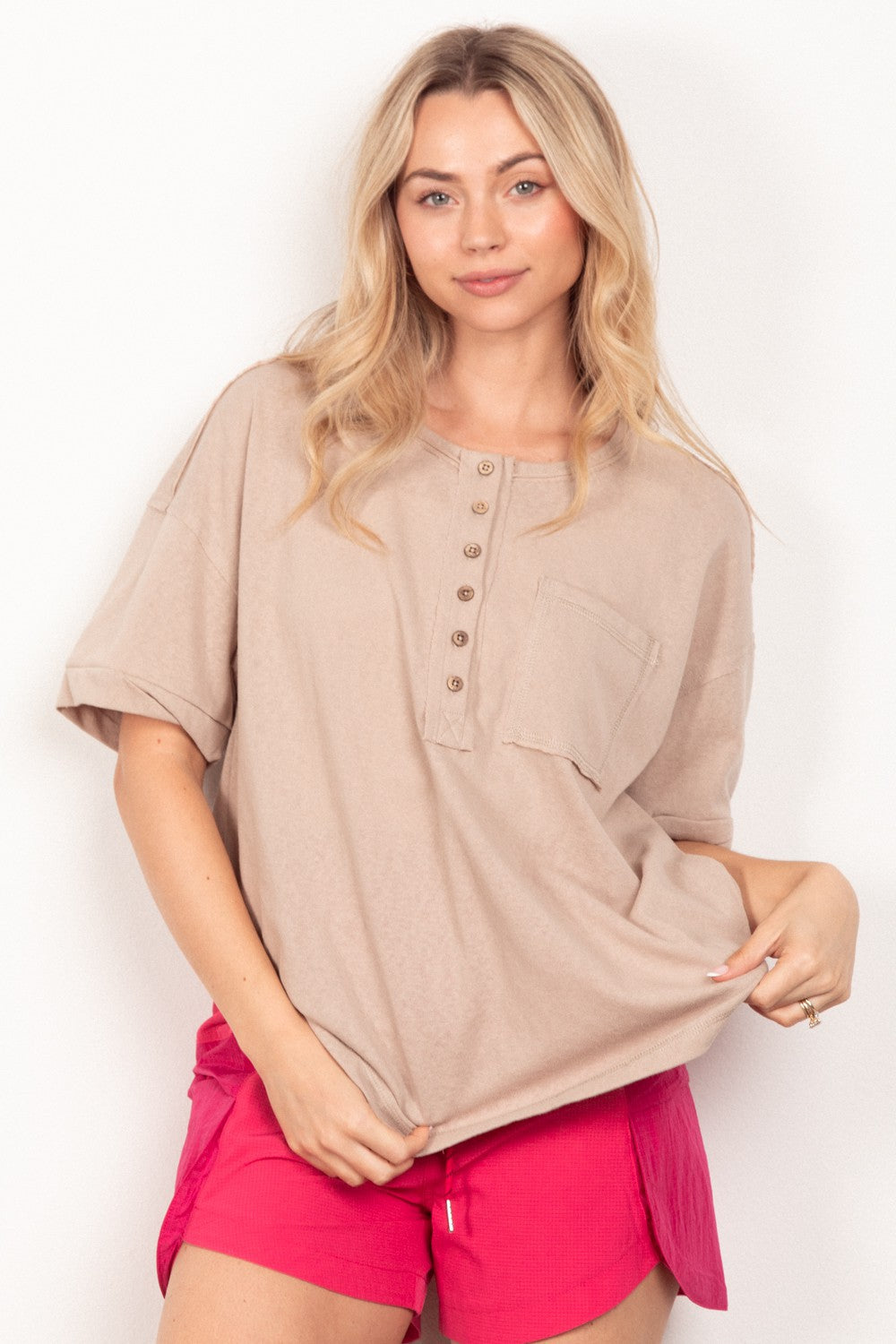 VERY J Twisted Sleeve Band Half Button TopComplete your 90s-inspired wardrobe with this essential twisted sleeve band Henley knit top featuring a round neck and relaxed fit. The drop shoulder design adds a t