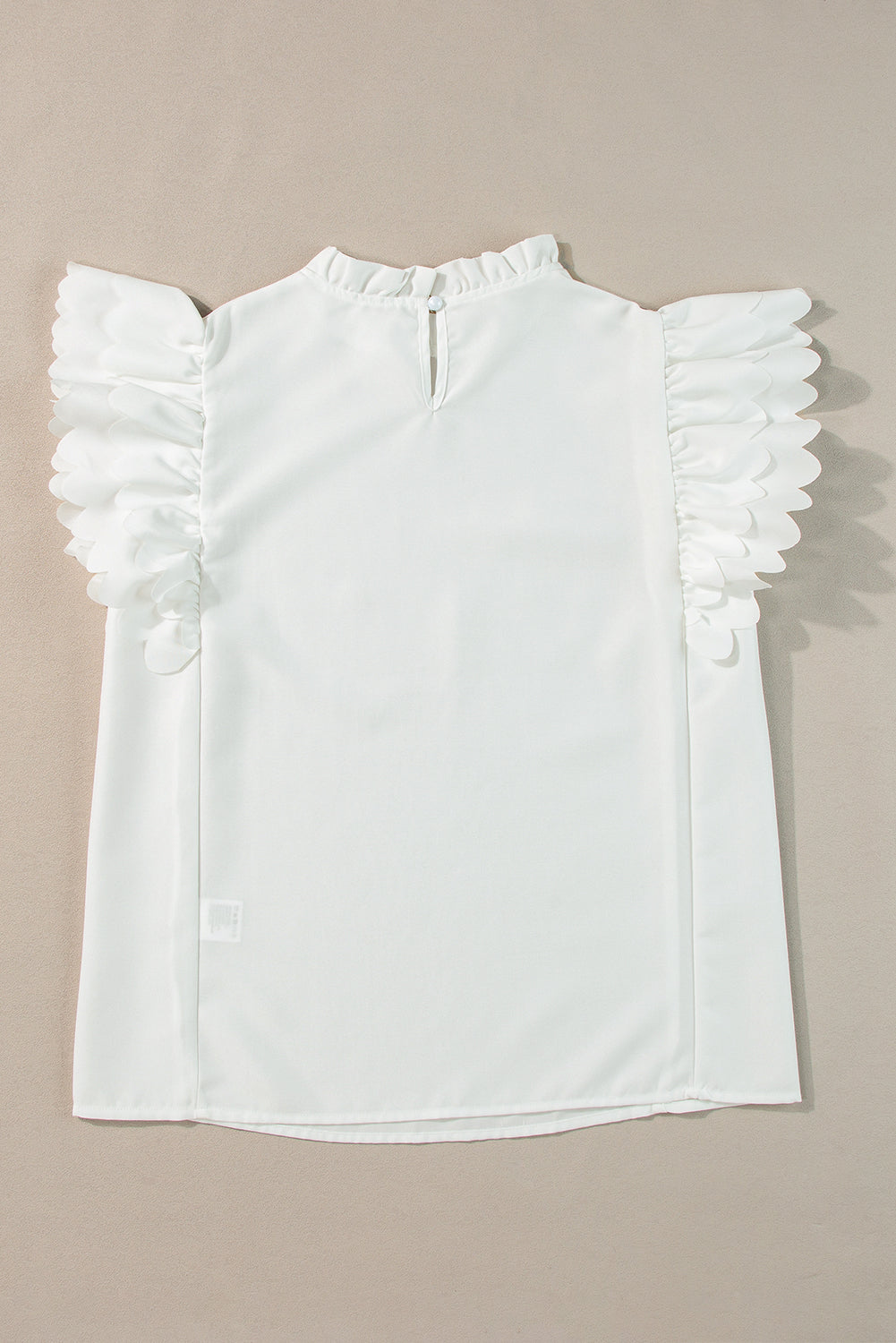 White Solid Color Scalloped Ruffle Sleeve BlouseMaterial:100%Polyester



		The blouse is a chic and feminine top featuring delicate scalloped edges and ruffle sleeves, adding a touch of elegance to your outfit.