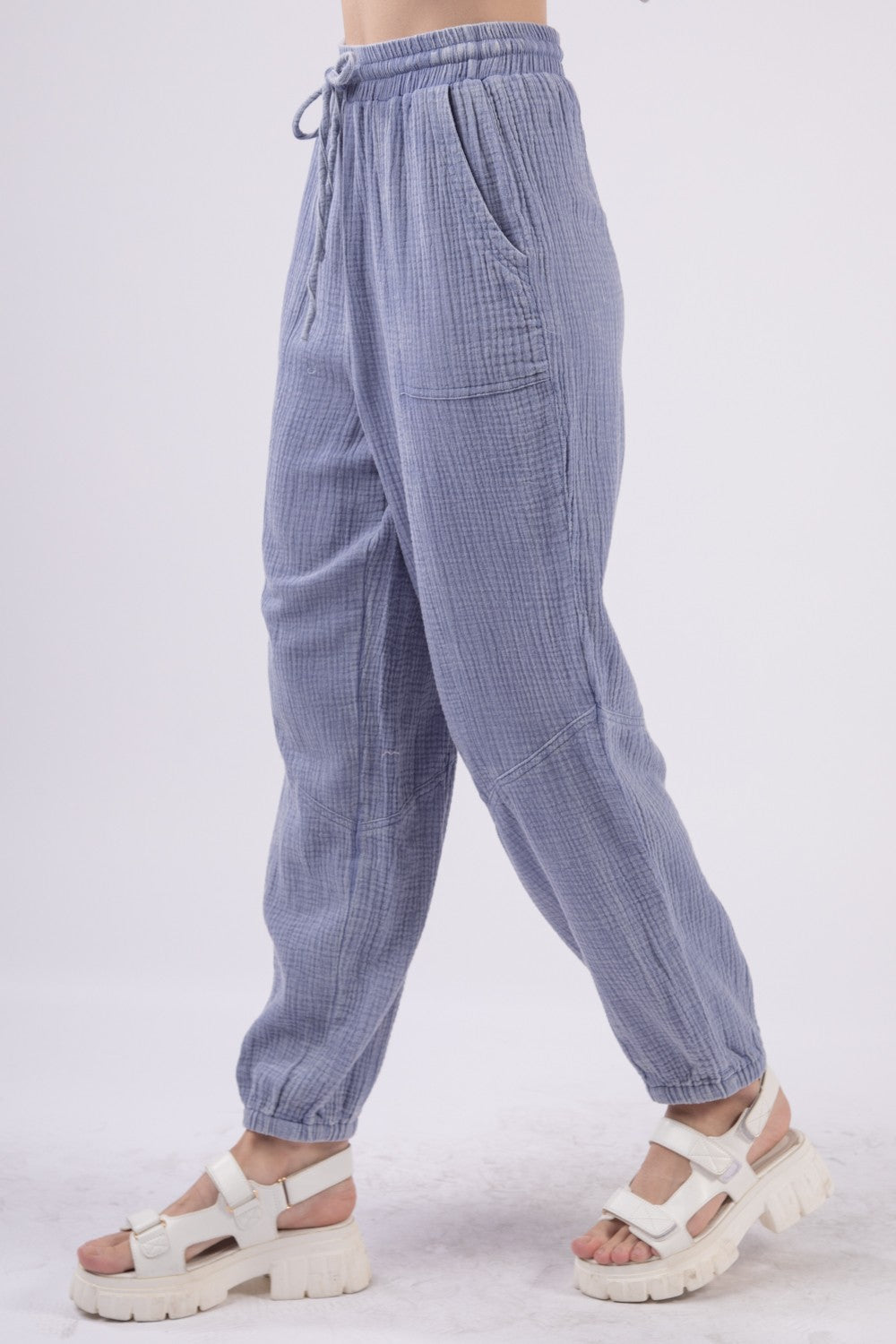 VERY J Washed Woven Crinkle Gauze Drawstring Cargo PantsStep out in style and comfort with these washed woven crinkle gauze cargo pants featuring a utility design that is both trendy and practical. The elastic waist and d