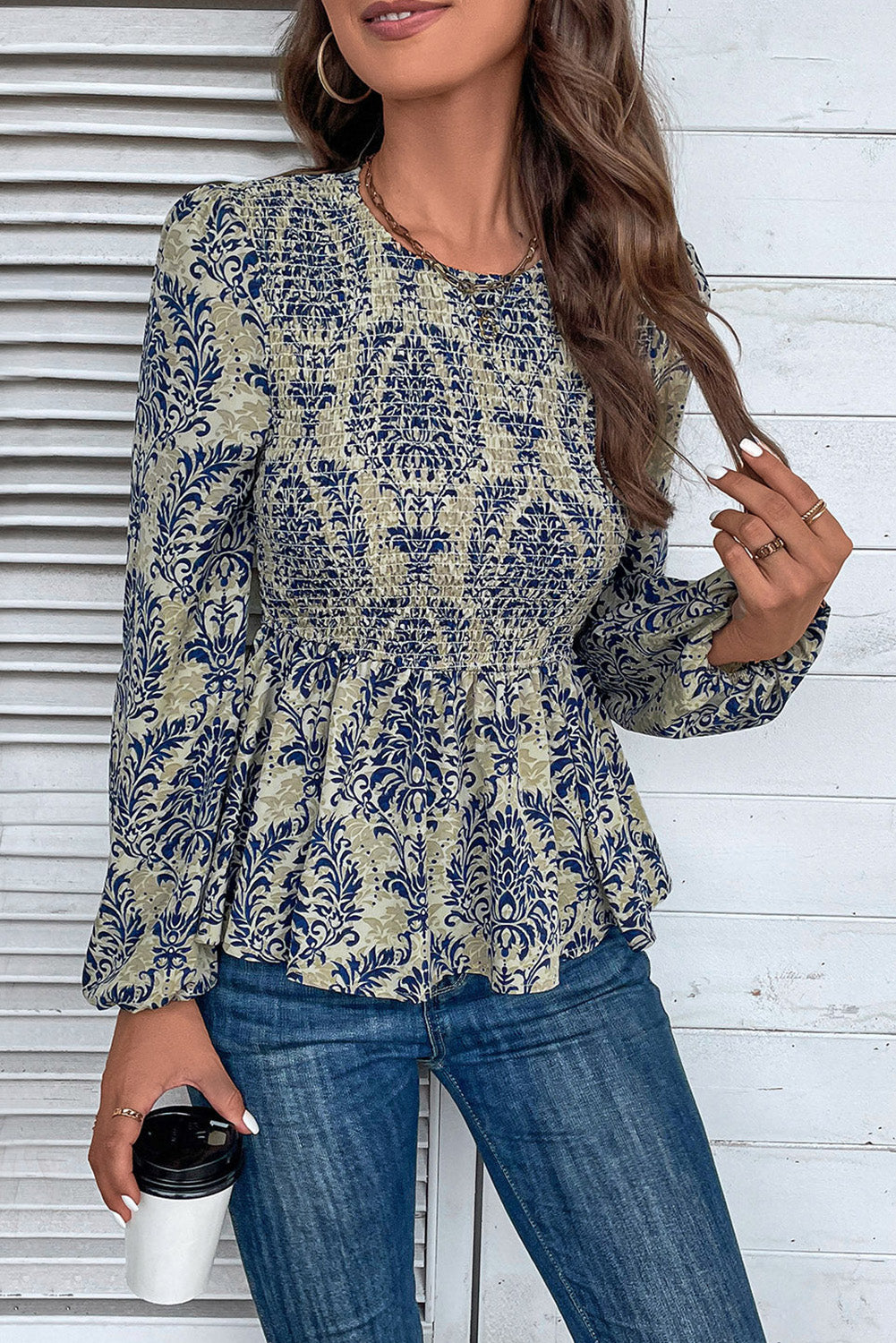 Sky Blue Ethnic Print Balloon Sleeve Smocked Peplum BlouseMaterial:100%Polyester

• Elevate your bohemian style with our blouse, featuring intricate ruffle details for a touch of whimsy.
• The shirred design creates a fla