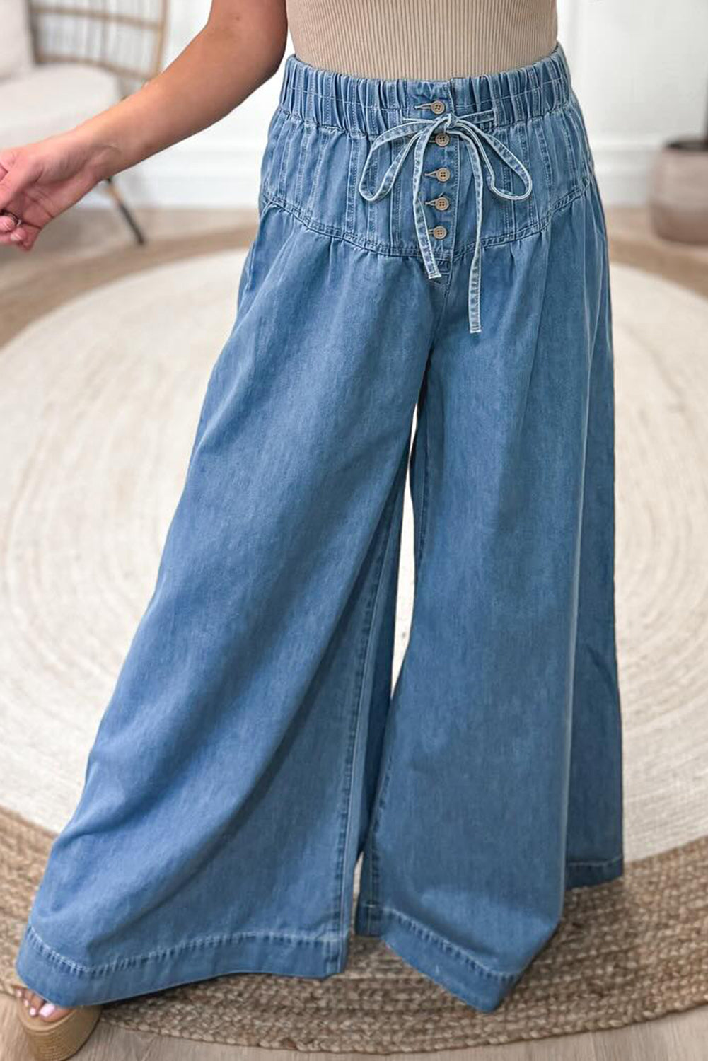 Dusk Blue Mineral Wash Button High Waist Wide Leg JeansMaterial:100%Cotton

• Crafted in a trendy mineral wash, these high waist wide leg jeans exude casual elegance, perfect for a laid-back yet stylish look.
• Featuri