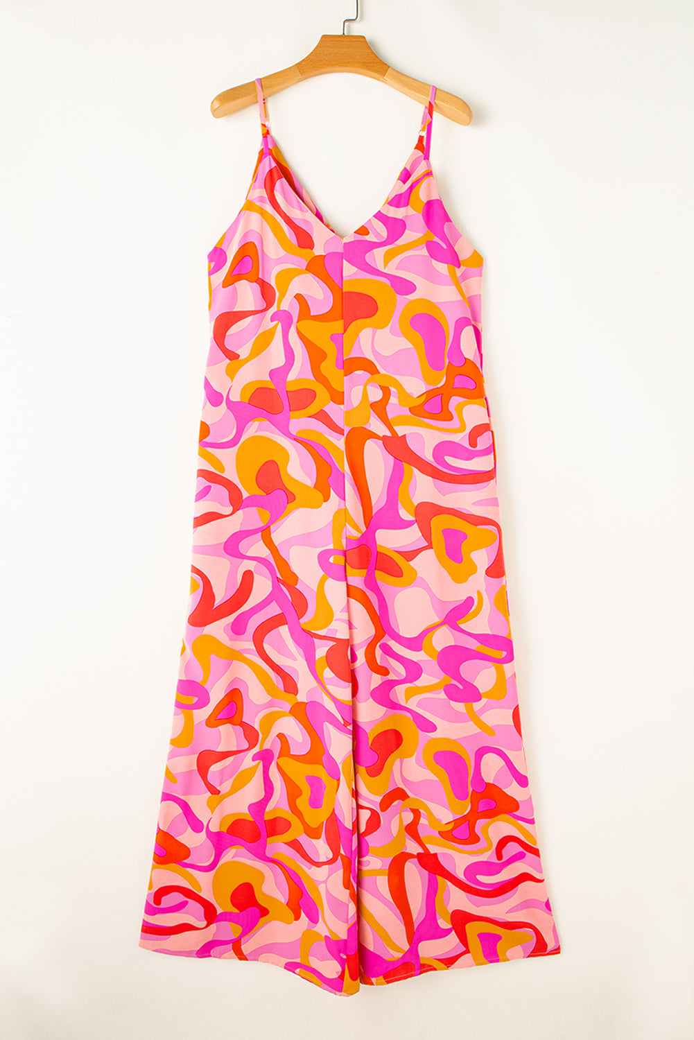 Pink Abstract Print V Neck Slouchy Wide Leg JumpsuitMaterial:100%Polyester

• Embrace a bohemian vibe with this jumpsuit, featuring a unique abstract pattern that adds a touch of artistic flair to your outfit.
• Sta