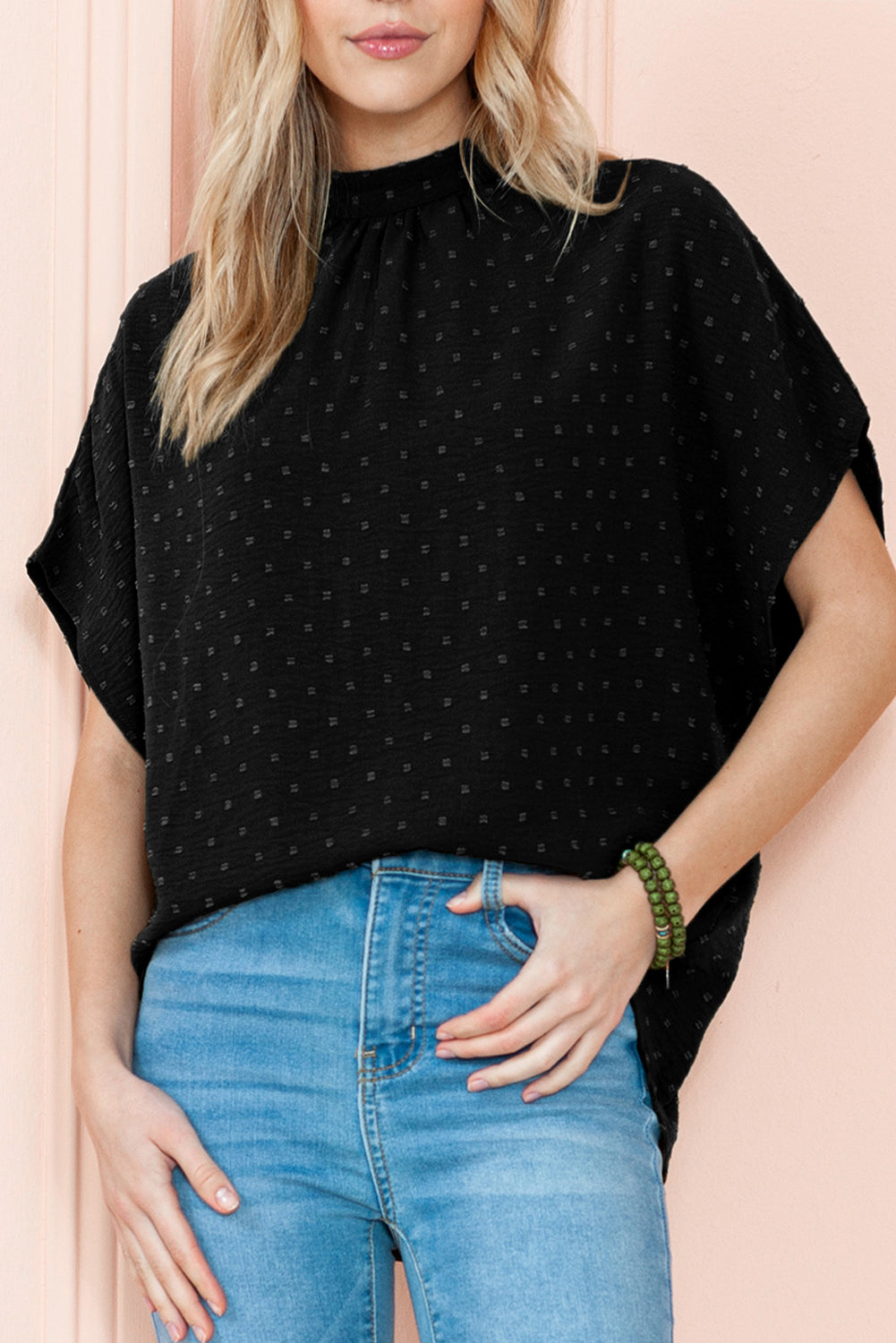 Black Swiss Dot Mock Neck Batwing Sleeve BlouseMaterial:100%Polyester



		The blouse has batwing sleeves, which are loose and draped sleeves that create a relaxed and voluminous look.
	
	
		It is designed w