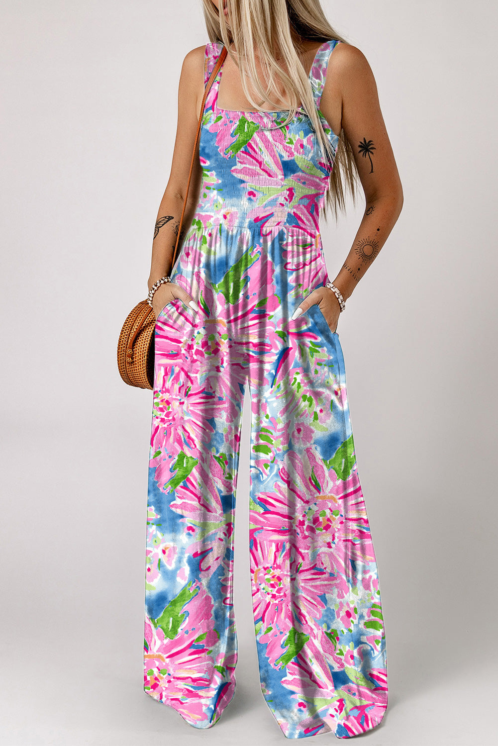 Pink Abstract Floral Painting Smocked Wide Leg JumpsuitMaterial:100%Polyester



		The jumpsuit features a colorful abstract floral print that adds a playful touch to the piece. 
	
	
		The smocked bodice creates a f