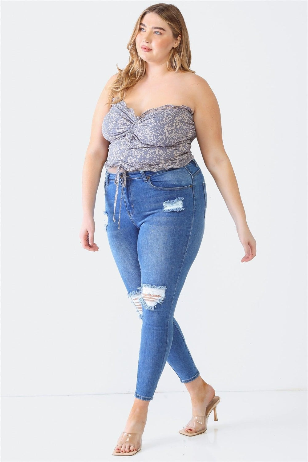 Zenobia Plus Size Drawstring Smocked Floral Tube TopThis drawstring smocked floral tube top is a feminine and summery addition to your wardrobe. The floral print adds a touch of freshness and charm, perfect for a casu