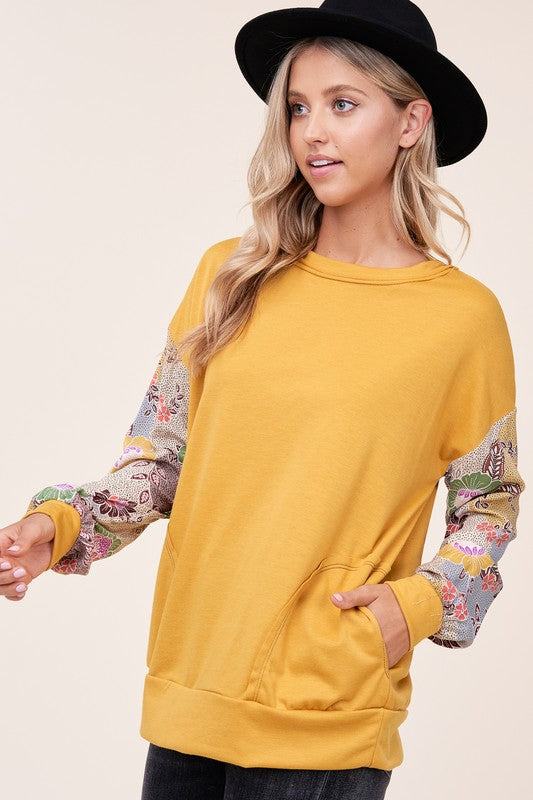 WOVEN FLORAL MIXED TOPFRENCH TERRY SOLID AND WOVEN FLORAL PRINT MIXED LONG SLEEVE SIDE POCKET RAW EDGE DETAIL TOP - MADE IN U.S.A.
Style: Casual
Print / Pattern: SOLID AND WOVEN FLORAL 
F