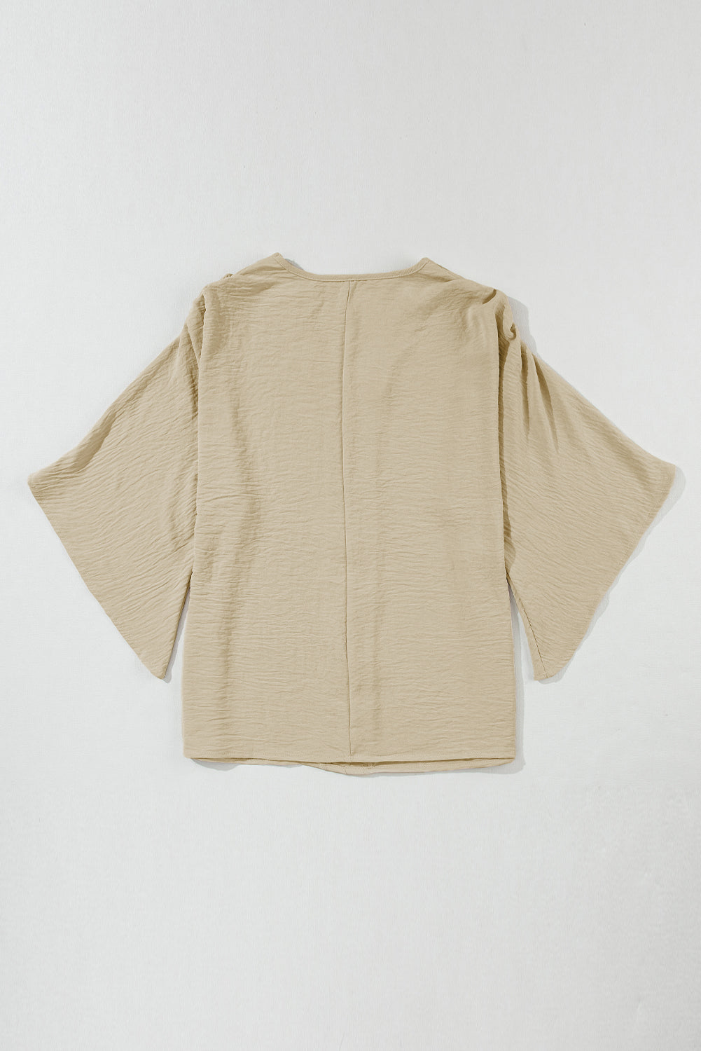 Parchment Solid Color Crinkled V Neck Ruffled Sleeve BlouseMaterial:100%Polyester



		The blouse comes in a solid color, which provides a clean and versatile look. 
	
	
		The crinkled effect also makes the blouse resis