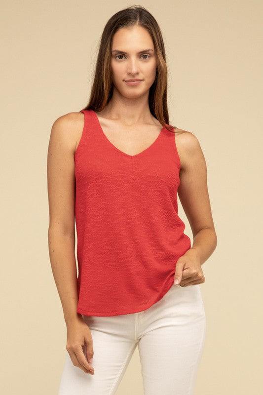 V Neck Sleeveless Cami TopThe V Neck Sleeveless Cami Top is a chic and versatile addition to any wardrobe. Featuring a flattering V neckline and a sleeveless design, this cami top is perfect 