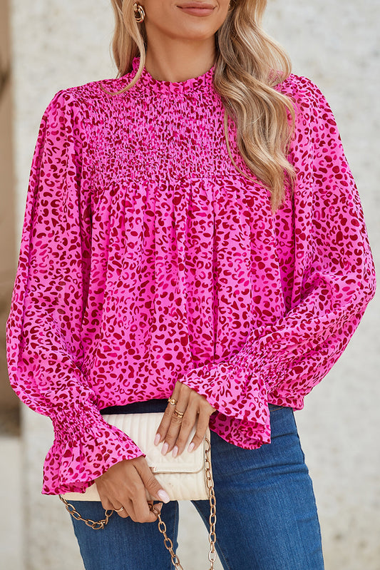 Rose Leopard Shirred Puff Sleeve Flowy BlouseMaterial:100%Polyester



		The blouse has a flowy silhouette, meaning it is loose and relaxed, draping away from the body. 
	
	
		The flowy silhouette of the b