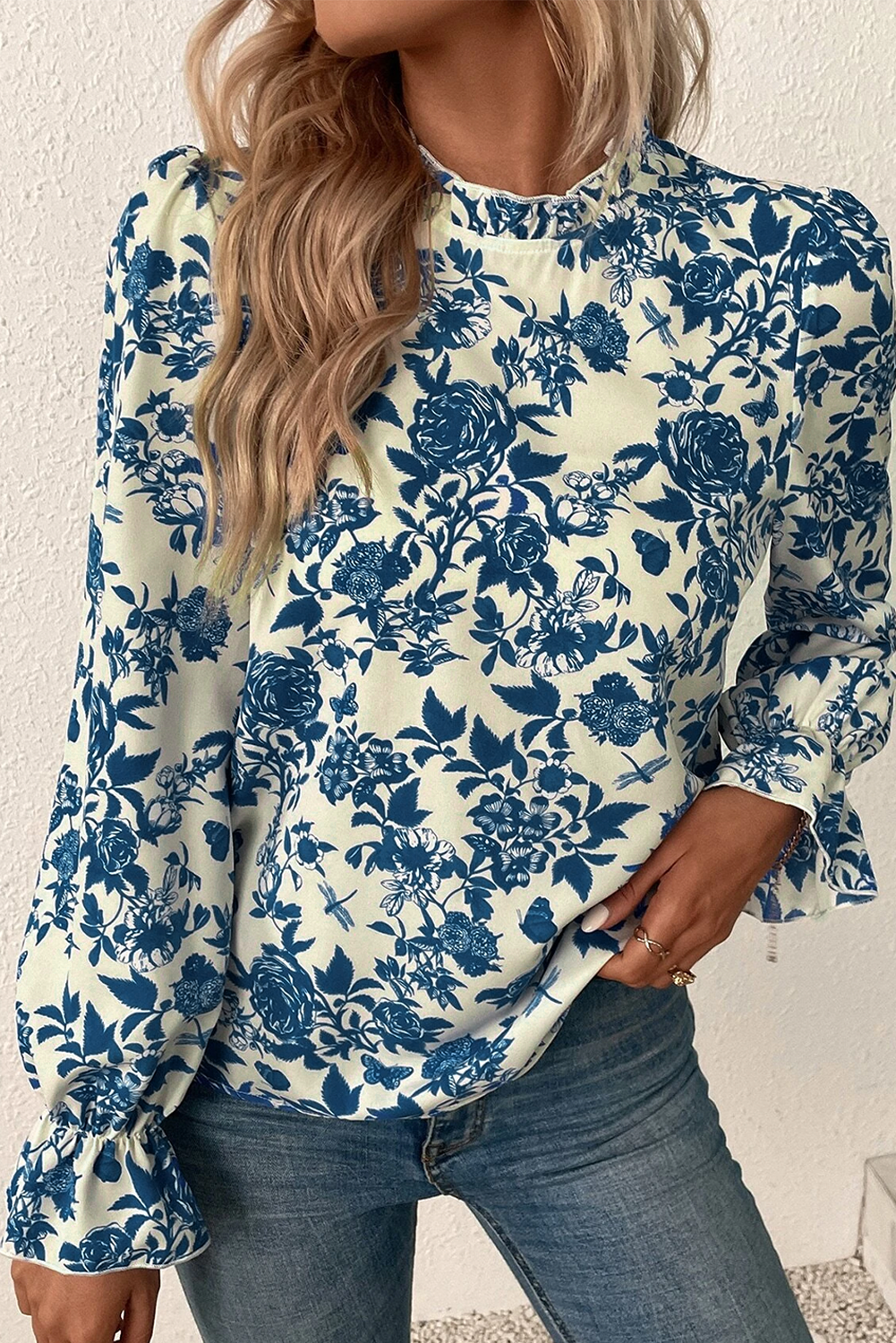 Sky Blue Floral Print Flounce Sleeve Keyhole Back BlouseMaterial:100%Polyester

• Embrace a bohemian vibe with our blouse, featuring intricate floral patterns that exude a free-spirited charm.
• The flounce sleeves add 