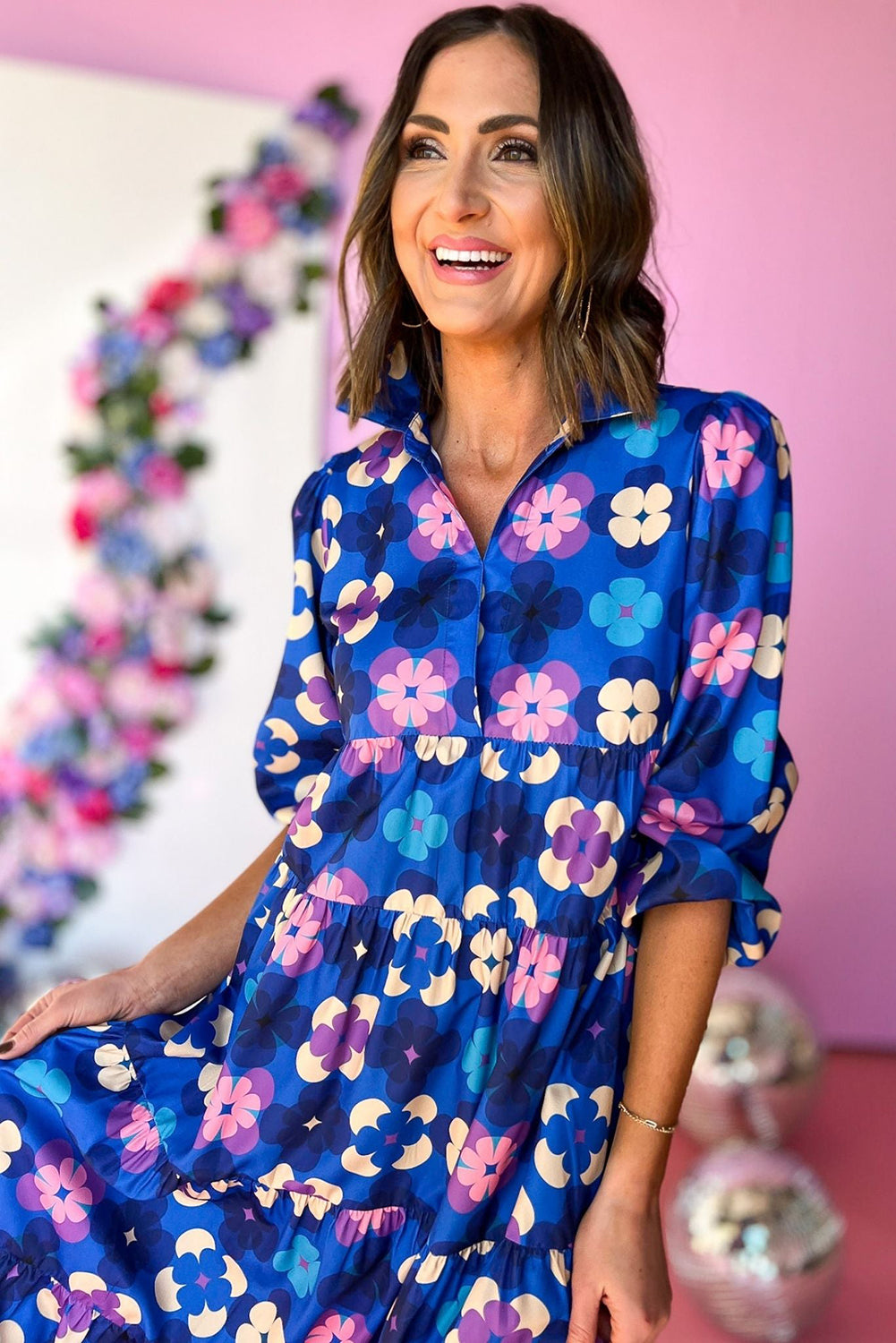 Blue Floral Peasant Sleeve Tiered Ruffle Midi DressMaterial:100%Polyester

• Embrace the charm of bohemian style with this midi dress, featuring a beautiful blue floral print that exudes effortless elegance.
• The 