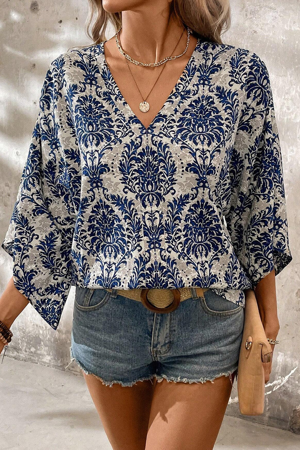 Blue Bohemian Print V Neck Flounce Sleeve BlouseMaterial:100%Polyester



		The three-quarter length sleeves offer a comfortable and stylish fit, perfect for both casual outings and special occasions.
	
	
		S