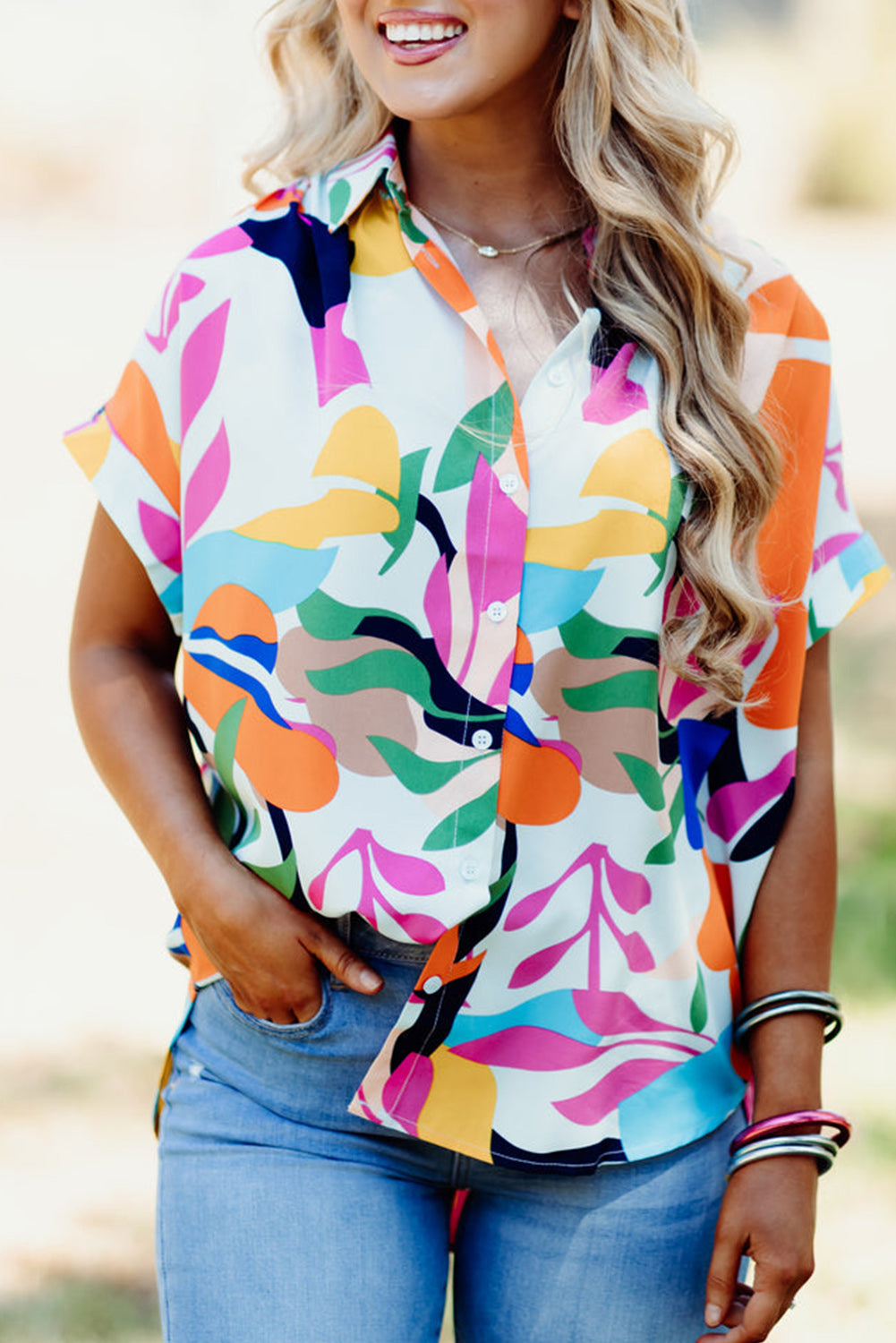 Multicolour Abstract Leaf Print Button Up Short Sleeve BlouseMaterial:100%Polyester

• Infuse your wardrobe with vibrancy in this blouse, perfect for a relaxed yet stylish look.
• The button-up design adds a touch of sophist