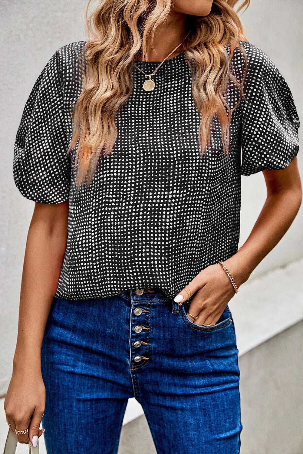 Black Dotted Puff Sleeve Round Neck BlouseMaterial:100%Polyester



		This blouse is designed with puff sleeves, which are characterized by their voluminous and gathered appearance.
	
	
		The blouse is 