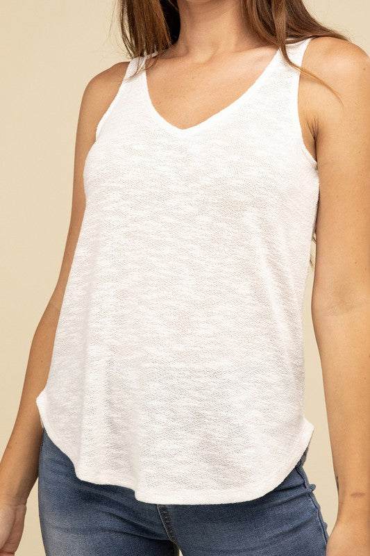 V Neck Sleeveless Cami TopThe V Neck Sleeveless Cami Top is a chic and versatile addition to any wardrobe. Featuring a flattering V neckline and a sleeveless design, this cami top is perfect 