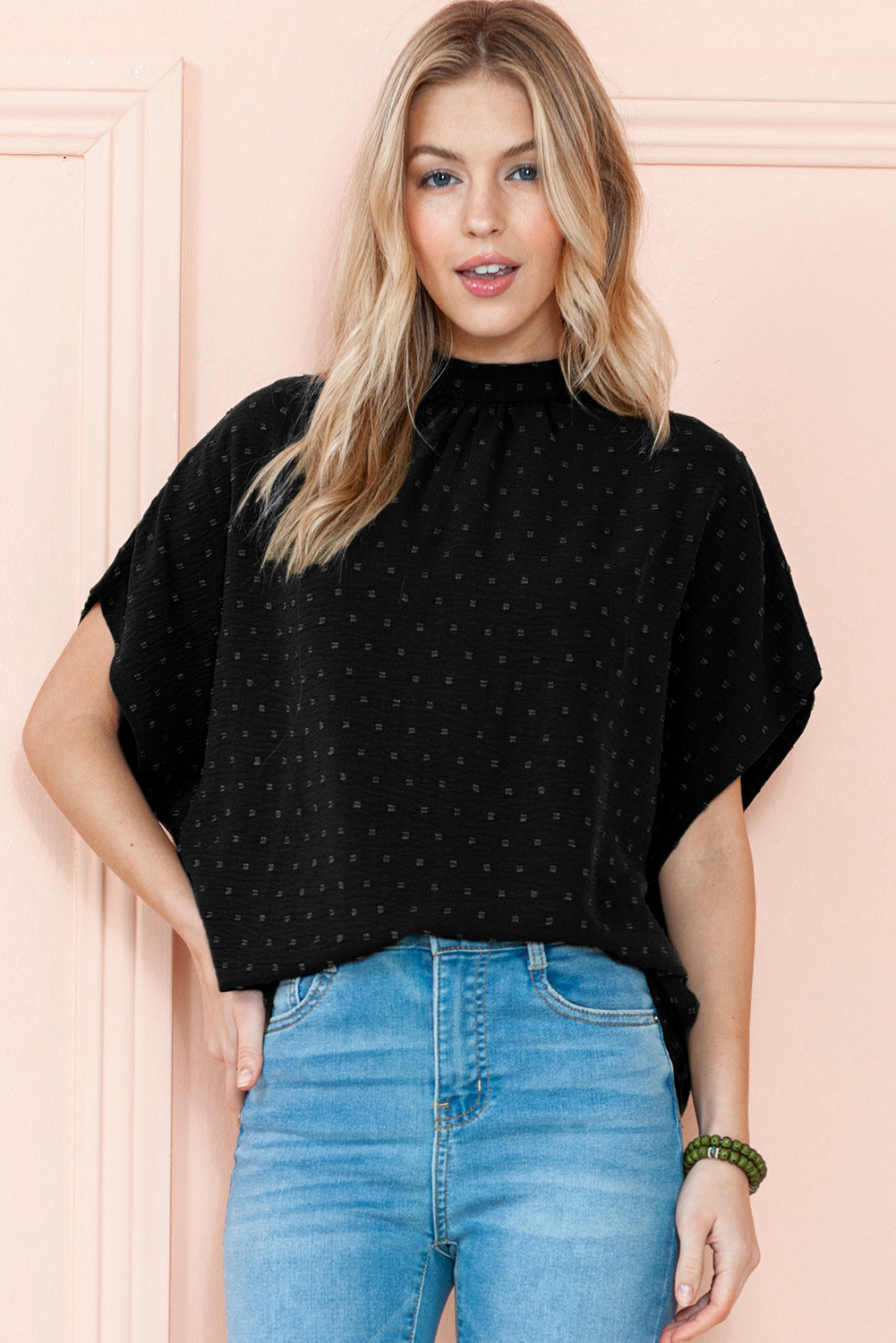 Black Swiss Dot Mock Neck Batwing Sleeve BlouseMaterial:100%Polyester



		The blouse has batwing sleeves, which are loose and draped sleeves that create a relaxed and voluminous look.
	
	
		It is designed w