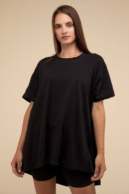 Cotton Drop Shoulder Oversized TopThe Cotton Drop Shoulder Oversized Top is a chic and comfortable addition to your wardrobe. With raw edge details adding a touch of edge, this top offers a relaxed, 