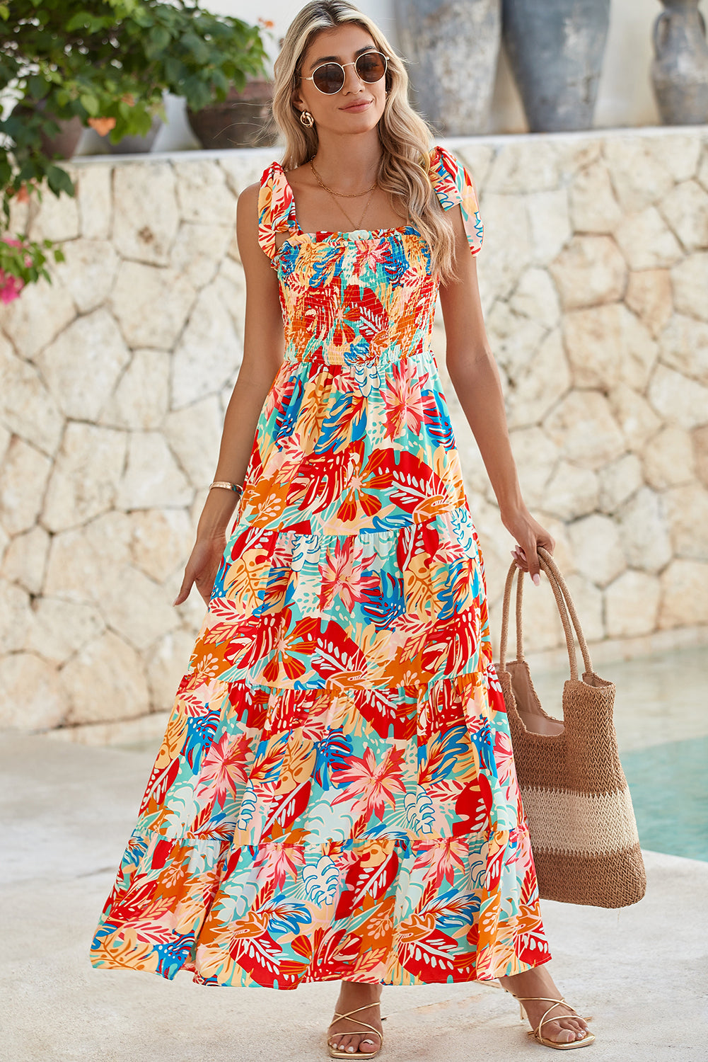 Multicolor Boho Tropical Print Smocked Ruffle Tiered Maxi DressMaterial:100%Polyester



		•The tiered design of the dress adds volume, creating a flowy and feminine look.
	
	
		•Smocked bodice and tie shoulder straps give 