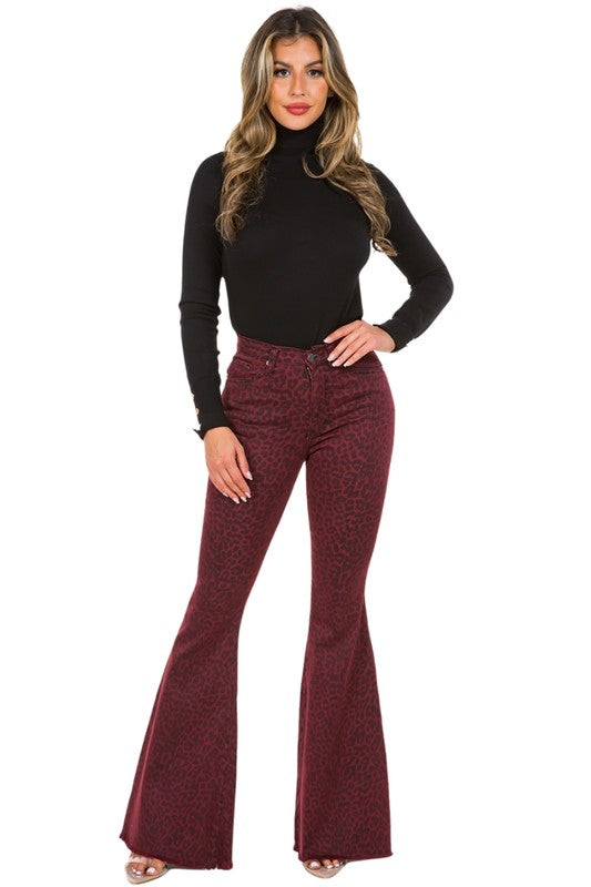 Leopard Bell Bottom Jean in BurgundyFull Length 5 pocket bell bottom jean features frayed hem, Front and back pockets, Burgundy Denim leopard Print,33.5" inseam, 10.5" Rise, Stretch Denim, Made in USAM