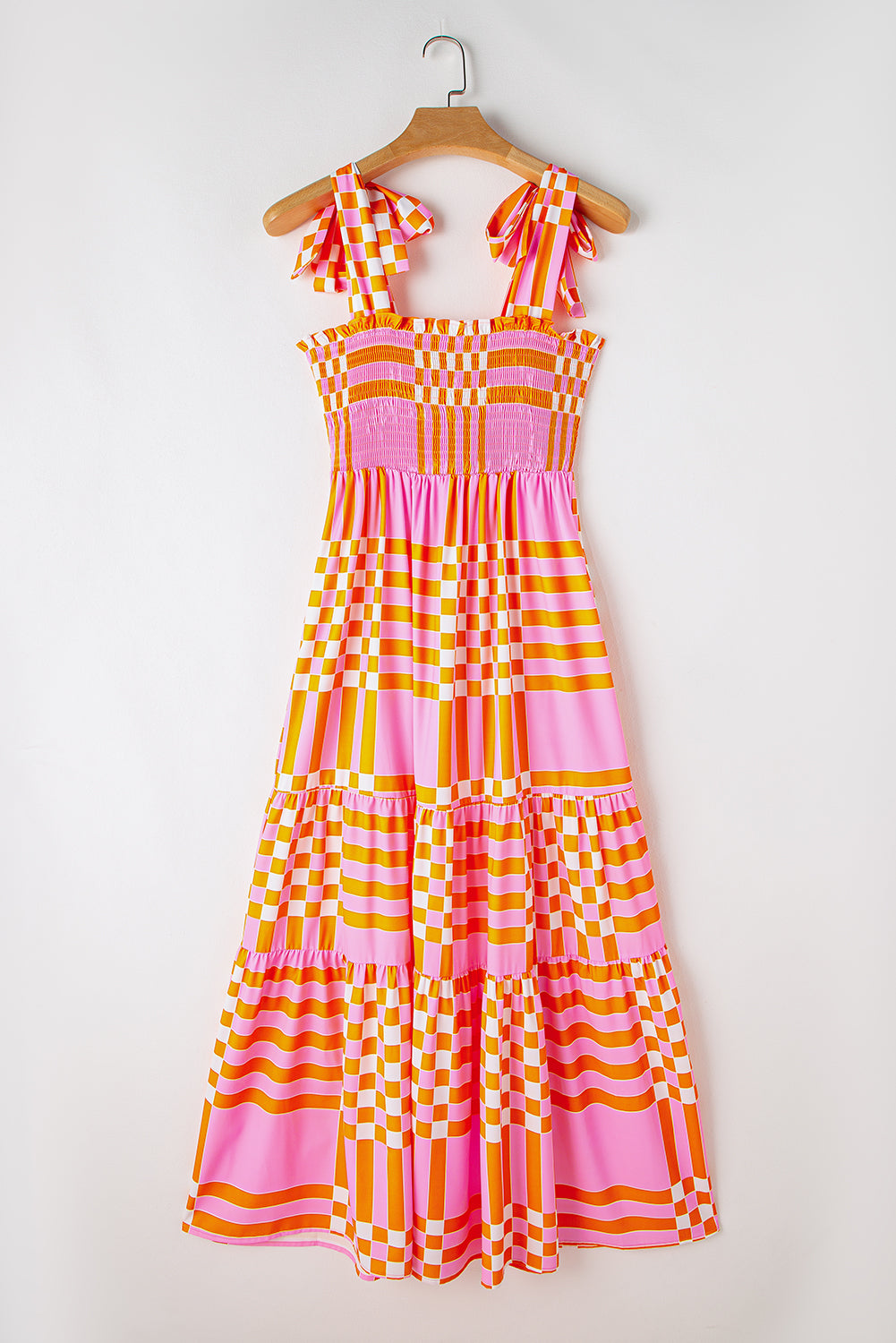 Pink Tie Strap Plaid & Striped Smocked Maxi DressMaterial:100%Polyester



		Embrace the sunshine with this flowy long dress
	
	
		It’s a elegantly flared dress with tiered skirt and self-tie straps
	
	
		F