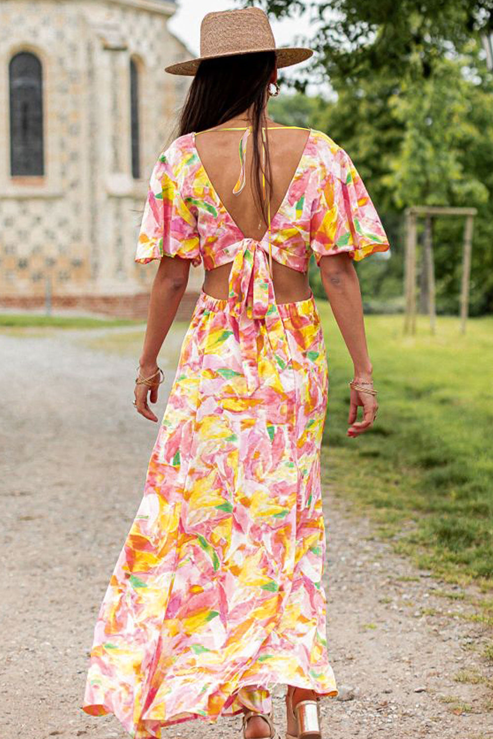 Pink Flutter Sleeve Cut-out Bohemian Floral Maxi DressMaterial:100%Polyester



		Made from a lightweight and breathable fabric, this maxi dress features flutter sleeves that create a graceful and flowy look, perfect 