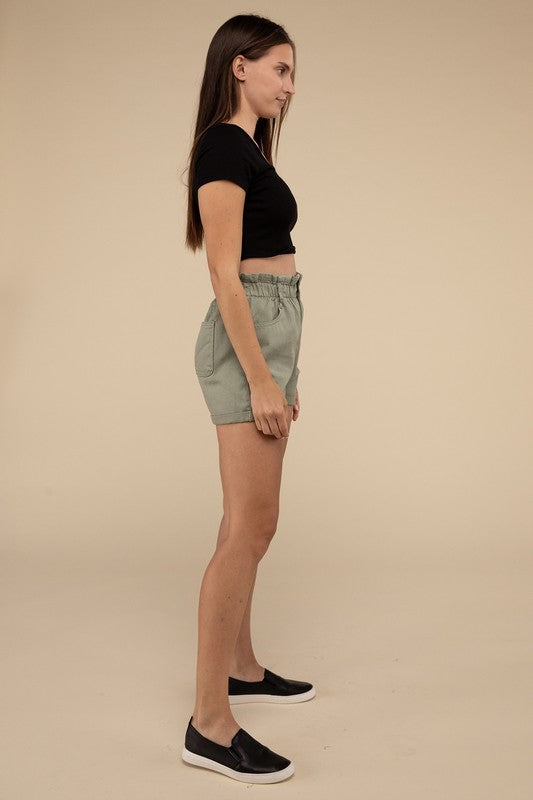 Double Buttoned Waistband Denim ShortsThe Double Buttoned Waistband Denim Shorts are a stylish and comfortable addition to your wardrobe. Featuring a unique double-button closure and a charming ruffled w