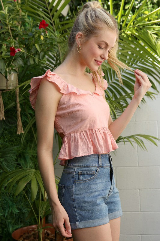 SL ruffled top with flare*Pink open back tie peplum top with ruffle trim*Pattern type : solid*Neck line : round scoop neck*Sleeve length : sleeveless*Stretch : no stretch*Sheer : not lined, 