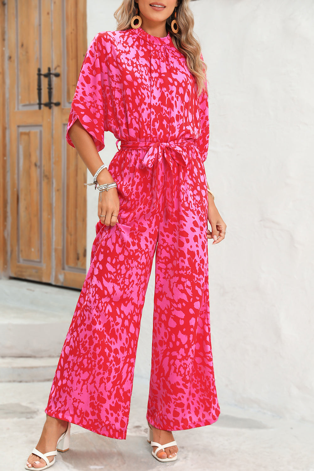 Rose Leopard Print Tulip Sleeve Belted Wide Leg JumpsuitMaterial:100%Polyester



		The jumpsuit features a trendy leopard print pattern, adding a bold and fashionable touch to your wardrobe.
	
	
		With its flounce s