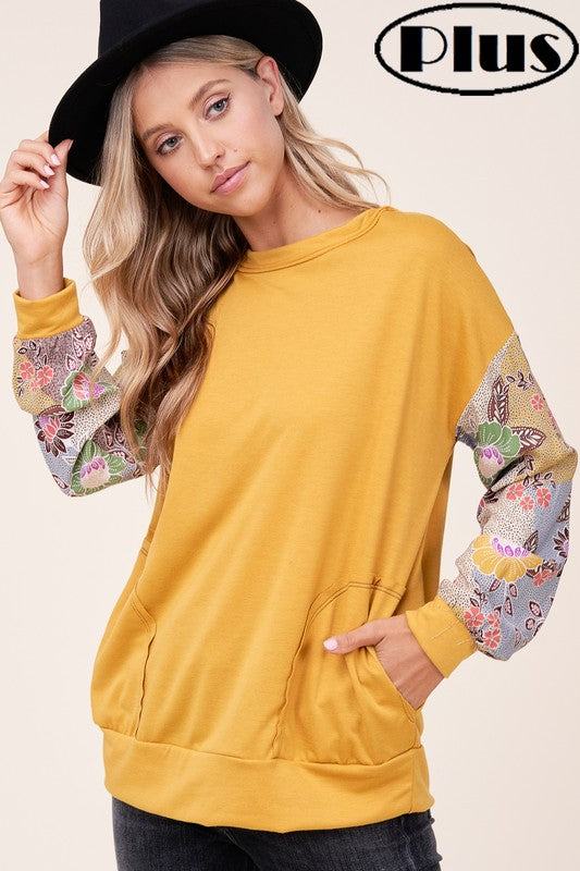 PLUS WOVEN FLORAL MIXED TOPFRENCH TERRY SOLID AND WOVEN FLORAL PRINT MIXED LONG SLEEVE SIDE POCKET RAW EDGE DETAIL PLUS TOP 
Style: Casual
Print / Pattern: SOLID AND WOVEN FLORAL 
Fit: Regular