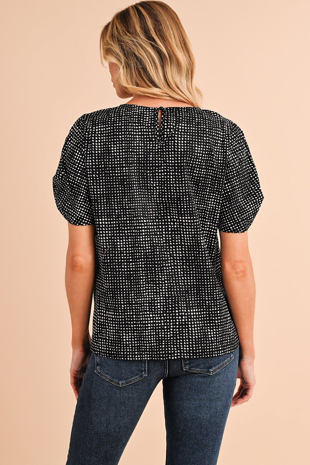 Black Dotted Puff Sleeve Round Neck BlouseMaterial:100%Polyester



		This blouse is designed with puff sleeves, which are characterized by their voluminous and gathered appearance.
	
	
		The blouse is 