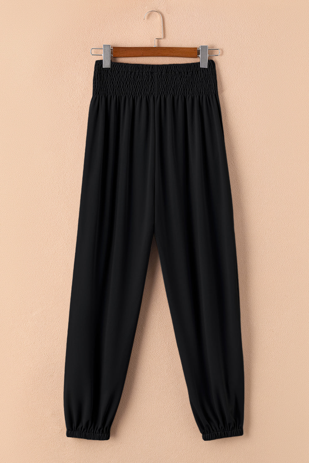 Black Pocketed Smocked High Waist JoggersMaterial:95%Polyester+5%Elastane



		These jogger pants are very cozy to wear with 95%Polyester+5%Elastane made
	
	
		The smocked design adds a stylish touch a