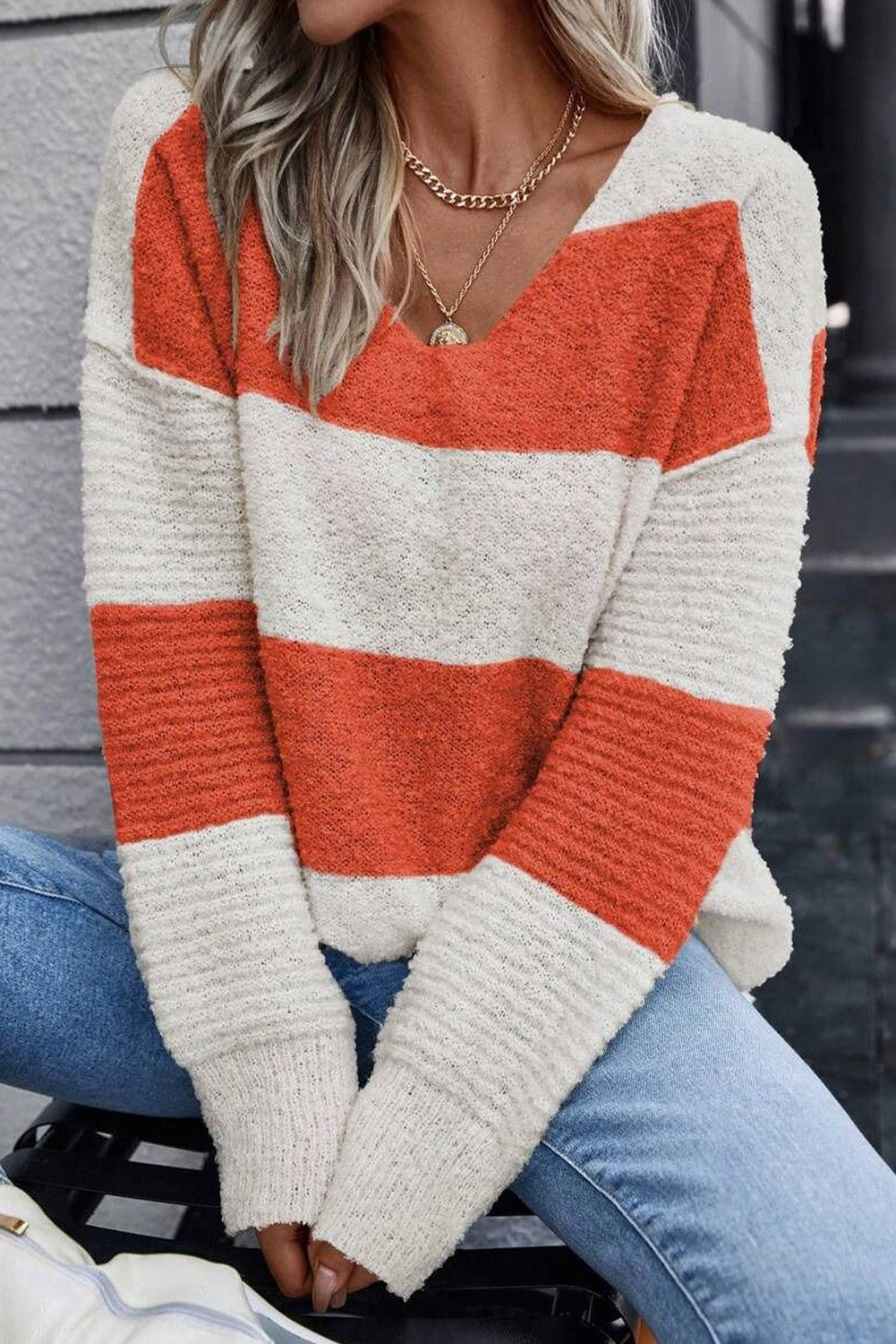 Orange Colorblock V Neck Side Slits SweaterMaterial:100%Acrylic

• Stand out in style with our sweater, blending casual stripes with a trendy rib-knit design.
• The vibrant orange hues add a pop of color to