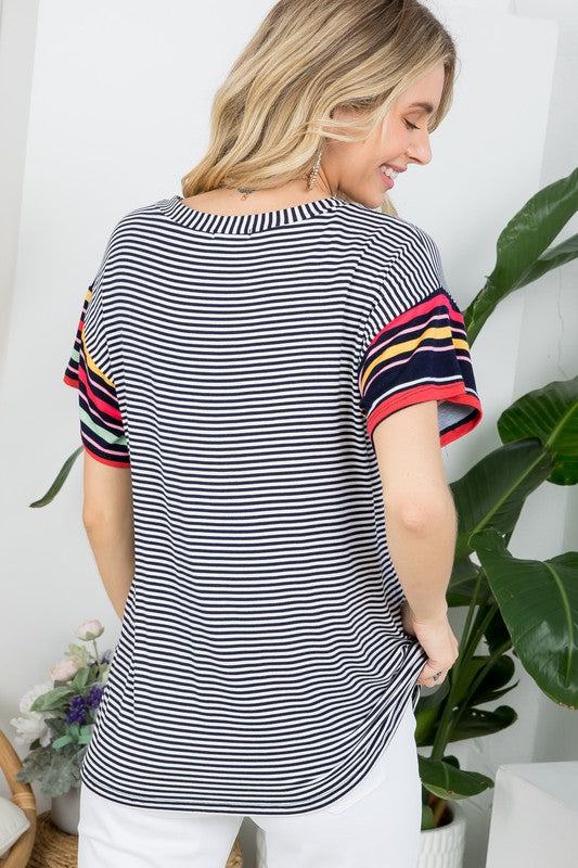 MULTI STRIPE BOXY TOP- Multi stripe boxy top- Pullover short sleeves- V neck chest pocket- Multi stripe jersey - Model is 5' 8" 34-24-34 and wearing a Small- S/M/L 2-2-2- 95% RAYON, 5% S