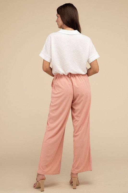 Waffle Trouser PantsElevate your everyday style with these waffle trouser pants. Crafted from textured waffle-knit fabric, they offer a perfect blend of comfort and sophistication. The 