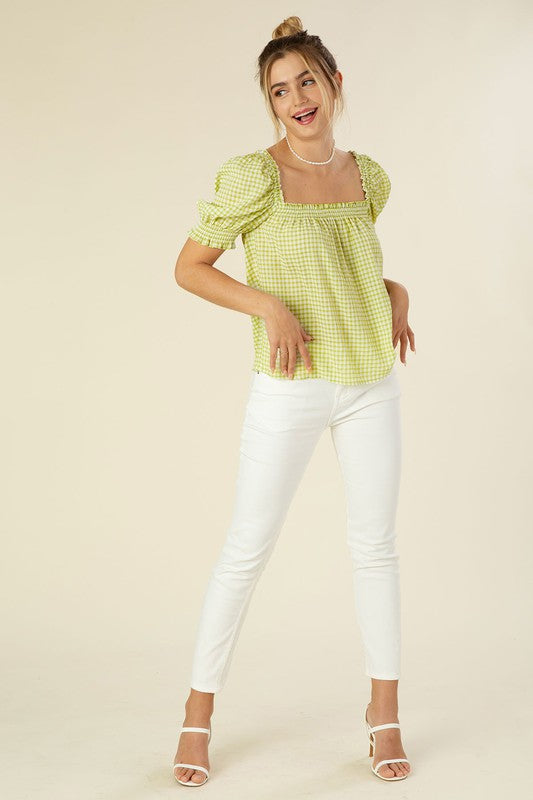 Smocked blouse with puff sleeve- Smocked blouse with puff sleeve- Pattern type : gingham check (yarn dyed)- Neck line : square neck- Sleeve type : puff sleeves- Sleeve length : short sleeves- Stre