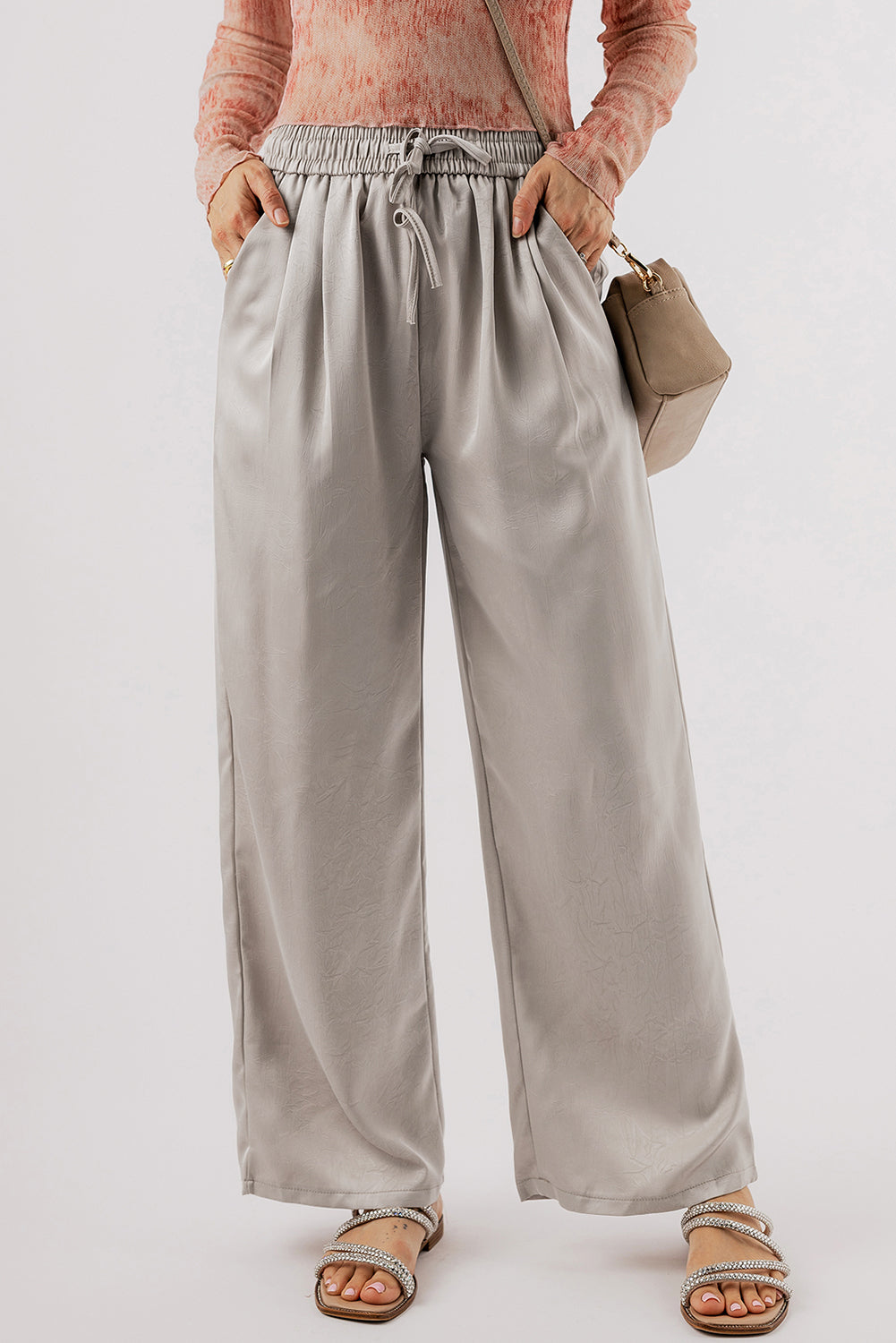 Jet Stream Solid Pleated Drawstring High Waist Wide Leg PantsMaterial:100%Polyester

• Elevate your wardrobe with the pants, designed for all-day comfort and style.
• The pleated detailing adds a touch of sophistication, whi