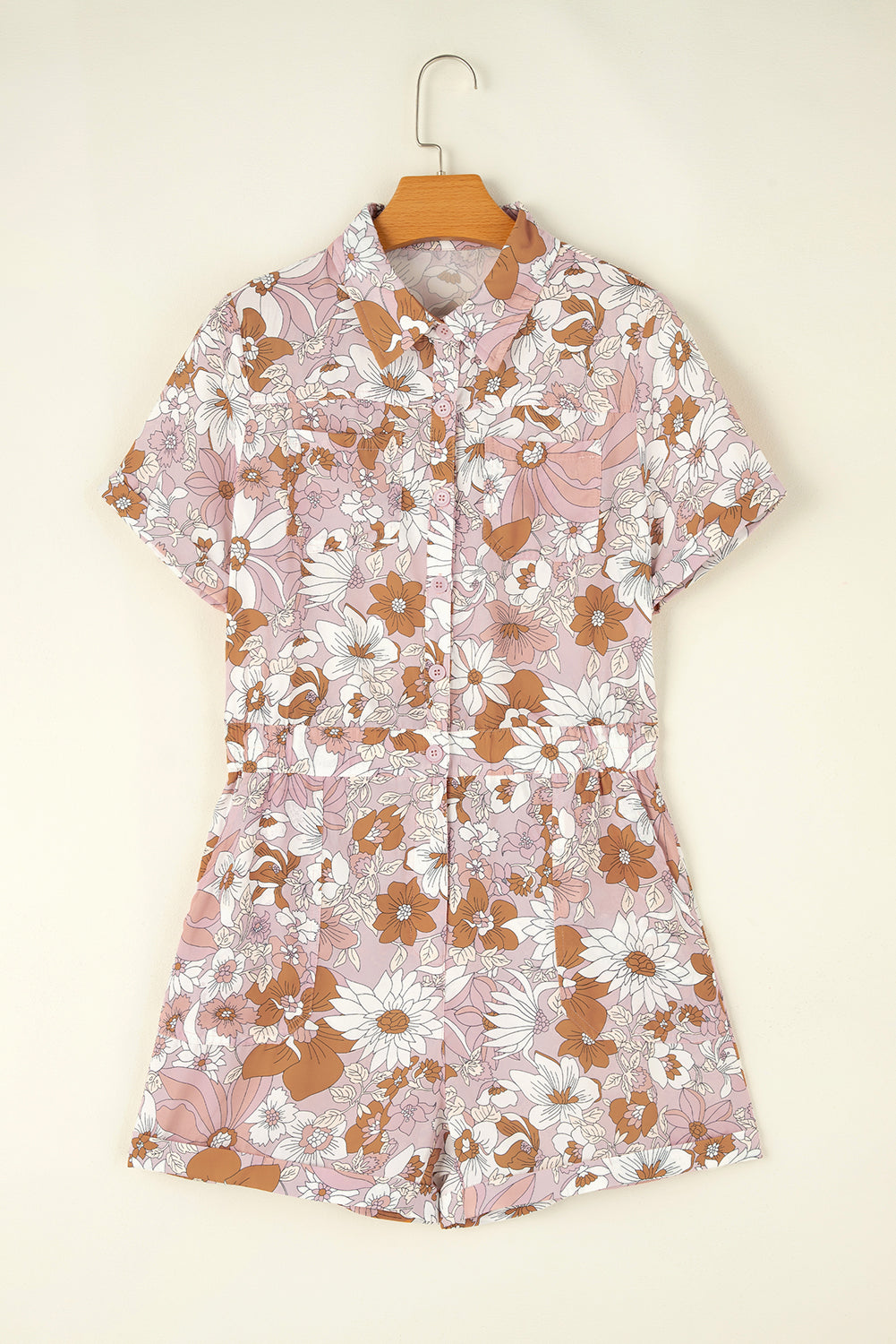 Pink Floral Print Collared Button Front RomperMaterial:100%Polyester

• Embrace a touch of femininity with the romper, featuring a delicate floral pattern that exudes charm and elegance.
• Stay comfortable and