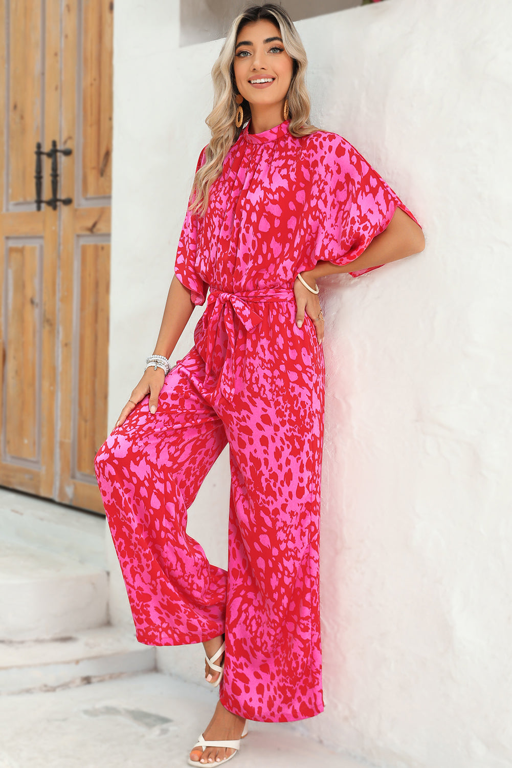 Rose Leopard Print Tulip Sleeve Belted Wide Leg JumpsuitMaterial:100%Polyester



		The jumpsuit features a trendy leopard print pattern, adding a bold and fashionable touch to your wardrobe.
	
	
		With its flounce s